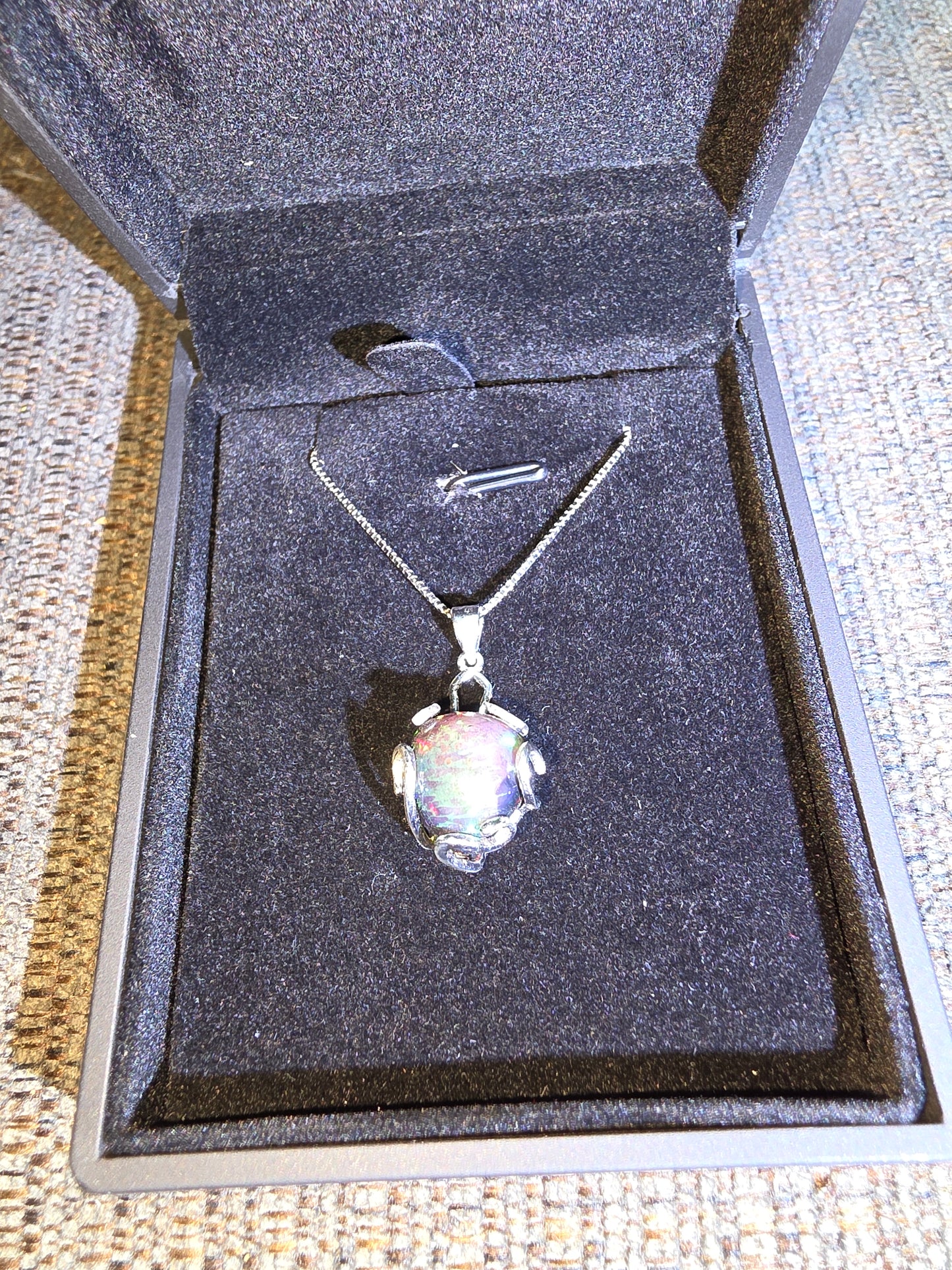 .925 Sterling Silver Necklace with a 7.76 Ct. DARK Ethiopian Opal with a beautiful play of color