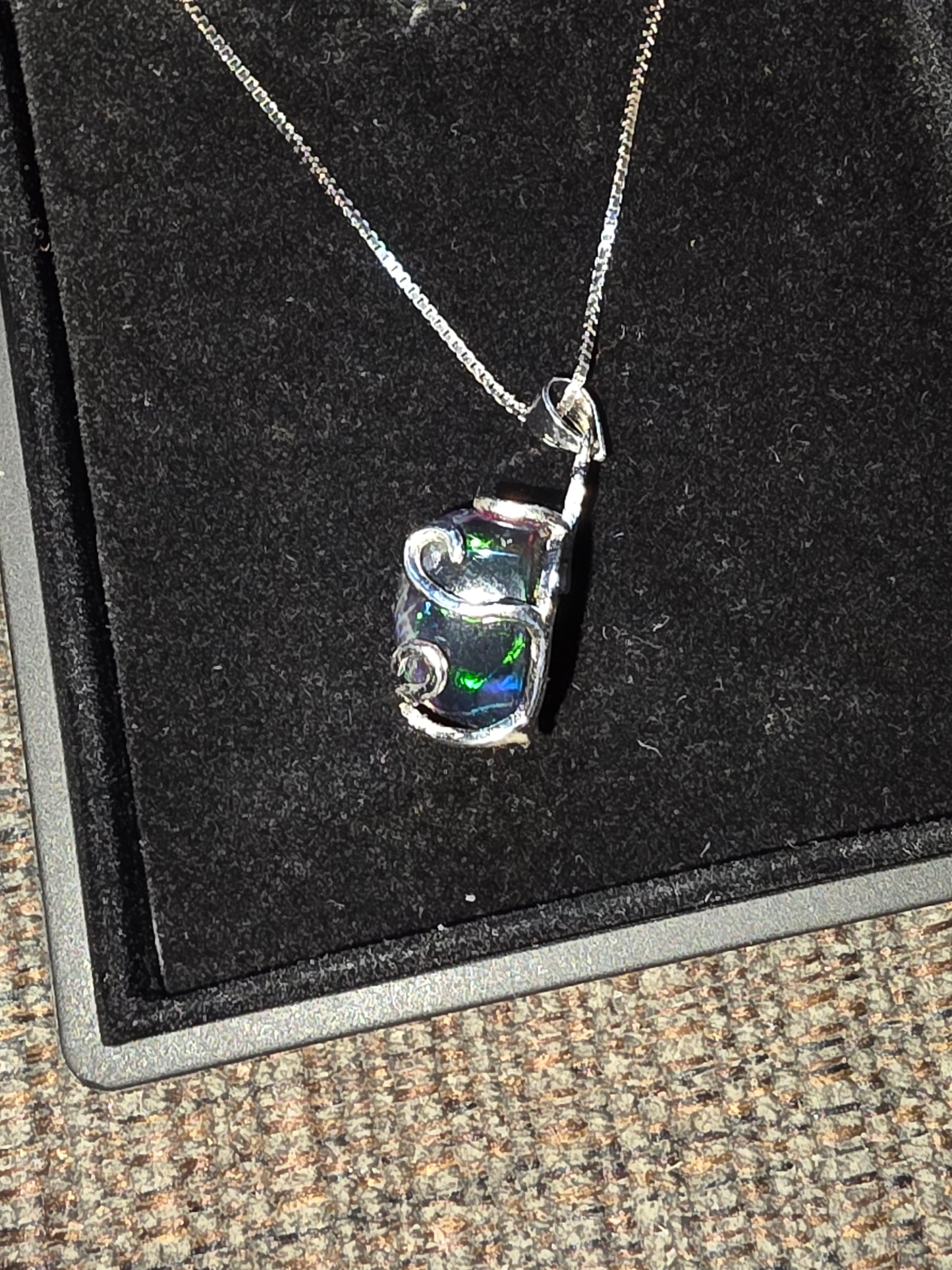 .925 Sterling Silver Necklace with a 7.76 Ct. DARK Ethiopian Opal with a beautiful play of color